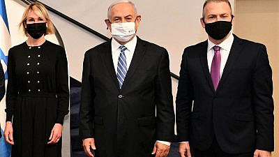 Israeli Prime Minister Benjamin Netanyahu is flanked by U.S. Ambassador to the United Nations Kelly Craft and Israeli Ambassador to the United Nations Gilad Erdan at the Prime Minister's Residence in Jerusalem on Dec. 24, 2020. Credit: Haim Zach/GPO.