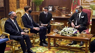 Then-Israeli National Security Adviser Meir Ben-Shabbat (left) and senior adviser to the U.S. president Jared Kushner (second from left) with Moroccan King Mohammed VI (right) at the royal palace in Rabat, Dec. 22, 2020. Credit: Amos Ben-Gershom/GPO.