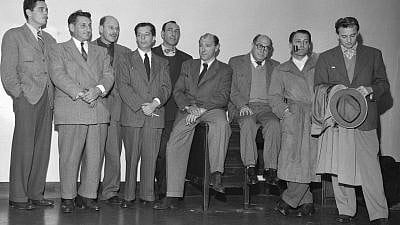 Nine Hollywood men charged with contempt of Congress give themselves up to the U.S. marshal on Dec. 10, 1947. From right: Ring Lardner Jr., John Howard Lawson, Alvah Bessie, Albert Maltz, Herbert Biberman, Lester Cole, Samuel Ornitz, Edward Dmytryk and Robert Adrian Scott.