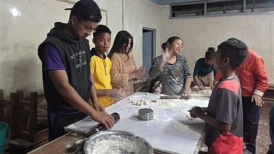 Members of the Bnei Menashe community in India make matzah prior to Passover, March 2021. Credit: Samuel Suantak, courtesy of Shavei Israel.