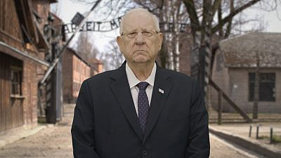 Israel's President Reuven Rivlin in front of the virtual gates to Auschwitz as part of the 2021 March of the Living online event. Credit: Office of the President for March of the Living.