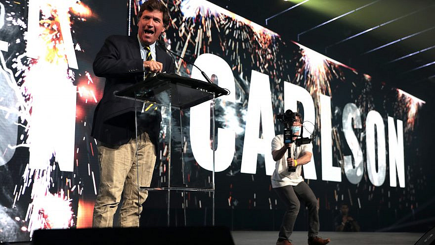 Fox News host and political commentator Tucker Carlson with attendees at the 2020 Student Action Summit, hosted by Turning Point USA, at the Palm Beach County Convention Center in West Palm Beach, Fla., on Dec. 19, 2020. Credit: Gage Skidmore via Wikimedia Commons.