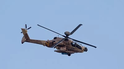 An IAF Apache attack helicopter at an aerial show in honor of an IAF Flight Course graduation ceremony at the Hatzerim Air Base in the Negev, Dec. 29, 2016. Photo by Miriam Alster/Flash90.