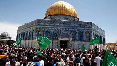 People wave Hamas flags outside the Dome of the Rock in Jerusalem, May 7, 2021. Photo by Jamal Awad/Flash90.