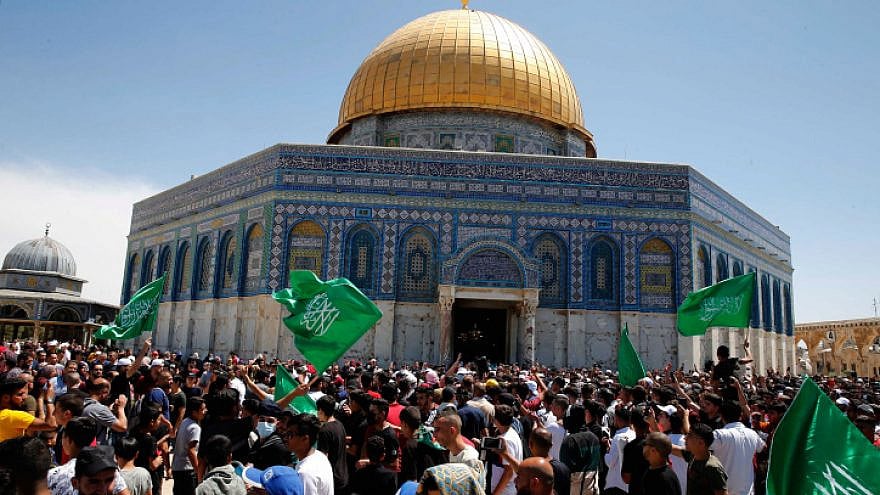 People wave Hamas flags outside the Dome of the Rock in Jerusalem, May 7, 2021. Photo by Jamal Awad/Flash90.