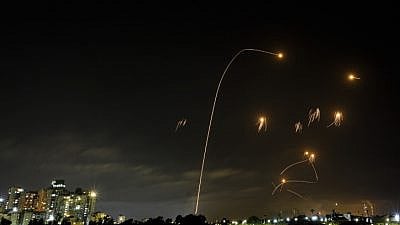 A long-exposure shot shows the Iron Dome air-defense system intercepting missiles launched from Hamas in the Gaza Strip towards Israel, as seen from the southern Israeli city of Ashkelon, on May 10, 2021. Photo by Edi Israel/Flash90.