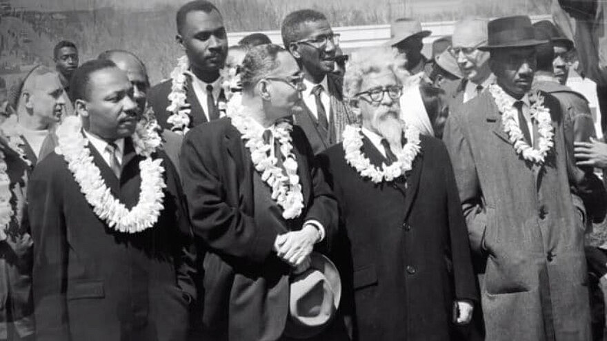 From the documentary film “Spiritual Audacity: The Abraham Joshua Heschel Story,” Rabbi Heschel (second from right) is seen marching with Martin Luther King Jr. and other black civil-rights leaders in Selma, Ala., on March 7, 1965. Source: Screenshot.