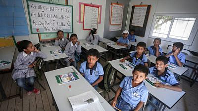 Palestinian students attend the opening of the academic year at the Khan al-Ahmar school near Jerusalem on Aug. 17, 2016. Credit: Flash90.