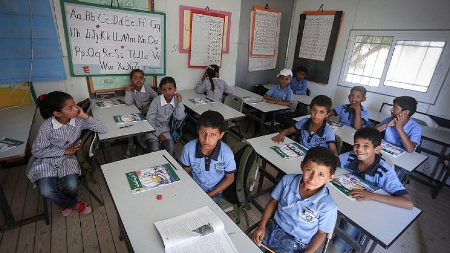 Palestinian students attend the opening of the academic year at the Khan al-Ahmar school near Jerusalem on Aug. 17, 2016. Credit: Flash90.