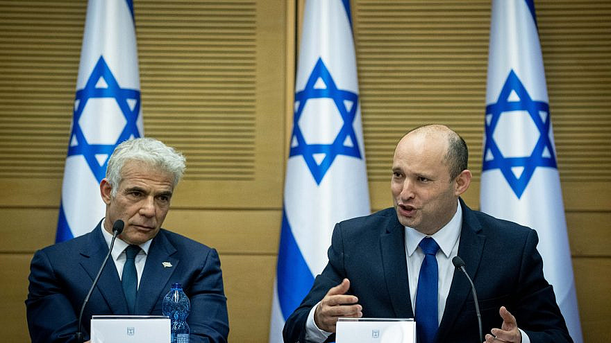 Israeli Prime Minister Naftali Bennett and Israeli Foreign Minister Yair Lapid attend the first government meeting, at the Knesset on June 13, 2021. Photo by Yonatan Sindel/Flash90.