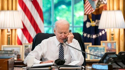 U.S. President Joe Biden speaks on the phone with Israeli Prime Minister Benjamin Netanyahu on May 12, 2021, in the Oval Office of the White House. Credit: Official White House Photo by Adam Schultz.