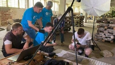 The team cataloging Jewish gravestones discovered in the Eastern European city of Brest. Credit: The Together Plan/Israel Newsstand.