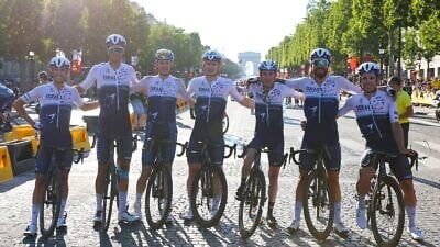 Cyclists with Team Israel Start-Up Nation posing on the Champs-Élysées, July 2021. Credit: Courtesy.