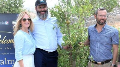 From left: Rebbetzin Dinie Scheiner, Rabbi Moshe Scheiner and Binyamin Regional Council head Israel Ganz at a Palm Beach Synagogue/Shiloh Partnership tree-planting event in Shiloh. Credit: Courtesy.