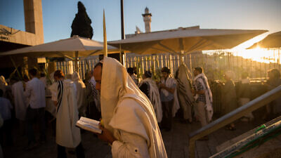 Jewish men pray at the entrance to the Temple Mount complex in Jerusalem on the holiday of Hoshana Raba, Oct. 11, 2017. Photo by Yonatan Sindel/Flash90.