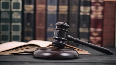 A judge's gavel. Credit: Corgarashu/Shutterstock.