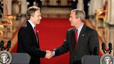 U.S. President George W. Bush and British Prime Minister Tony Blair shake hands after their press conference in the East Room of the White House on Nov. 12, 2004. Credit: White House Photo by Paul Morse.