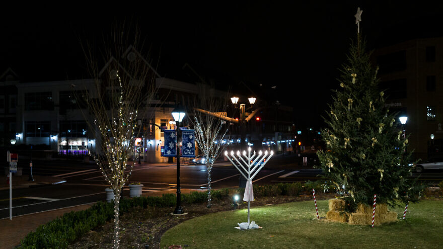 A menorah and Christmas tree in downtown Fairfax, Virginia. Dec. 24, 2017. Credit: Kristi Blokhin/Shutterstock.