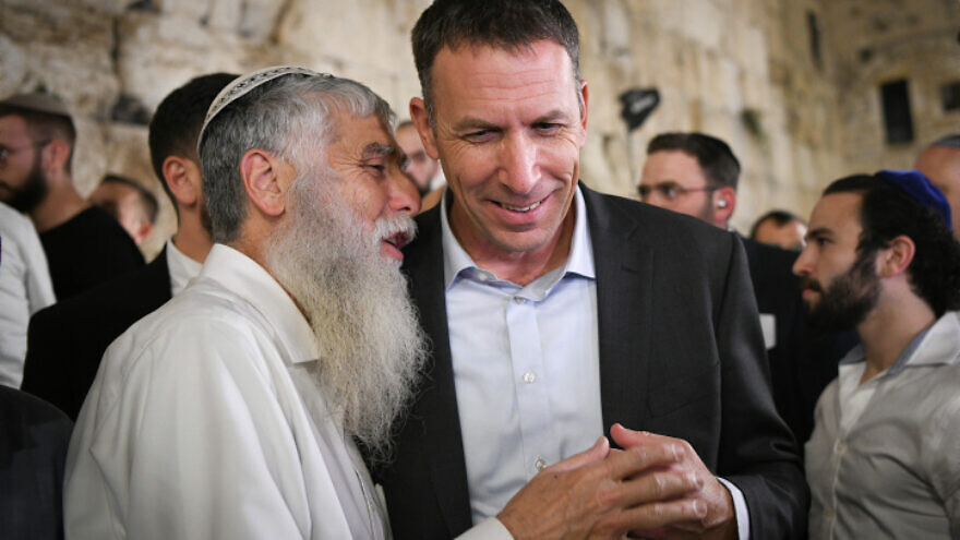 Religious Affairs Minister Matan Kahana attends a ceremony on the second night pf Hanukkah, at the Western Wall in Jerusalem, Nov. 29, 2021. Photo by Arie Leib Abrams/Flash90.