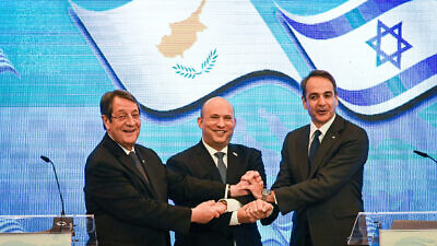 Israeli Prime Minister Naftali Bennett holds a press conference in Jerusalem with Cyprus President Nicos Anastasiades (left) and Prime Minister of Greece Kyriakos Mitsotakis as part of their eighth trilateral meeting, Dec. 7, 2021. Photo by Rafi Kutz/POOL.