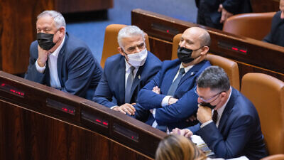 From left: Israeli Minister of Defense Benny Gantz, Foreign Affairs Minister Yair Lapid, Israeli Prime Minister Naftali Bennett and Israeli Minister of Justice Gideon Sa’ar during a plenum session and a vote on the state budget at the Knesset in Jerusalem on Nov. 3, 2021. Photo by Olivier Fitoussi/Flash90.