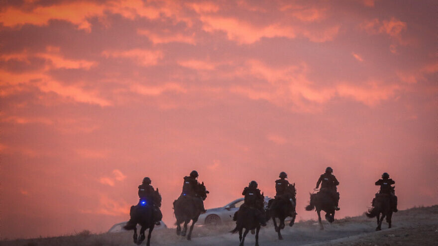 Israeli police clash with Bedouins during a protest against tree planting by the Jewish National Fund, outside the Bedouin village of al-Atrash in the Negev desert, Jan. 13, 2022. Photo by Jamal Awad/Flash90.
