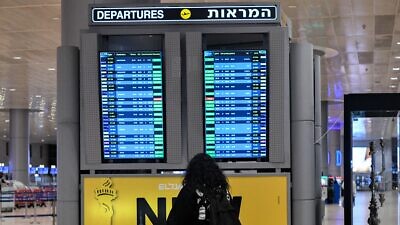 A traveler at Ben-Gurion International Airport near Tel Aviv on Jan. 4, 2022. Photo by Arie Leib Abrams/Flash90.
