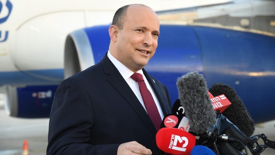 Israeli Prime Minister Naftali Bennett speaks to reporters before departing for Bahrain on Feb. 14, 2022. Credit: Haim Tzach/GPO.