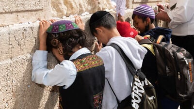 New immigrants from the Bnei Menashe community visited the Western Wall for the first time on March 9, 2022. Credit: Yehoshua Halevi/Courtesy of Shavei Israel.