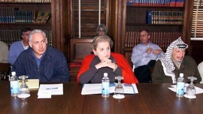 U.S. Secretary of State Madeleine Albright, Israeli Prime Minister Benjamin Netanyahu and PLO chairman Yasser Arafat at the Wye River Conference Center during the Wye River Memorandum talks, Oct. 16, 1998. Credit: U.S. Government, Department of Defense via Wikimedia Commons.