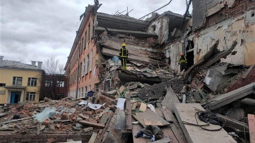 Ukrainian rescuers check the remains of a school in Chernigiv after the Russian shelling of the city, March 6, 2022. Credit: Міністерство внутрішніх справ України via Wikimedia Commons.
