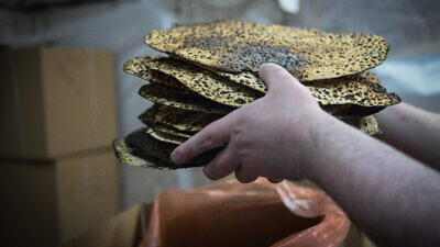 Baking shmurah matzah in Jerusalem for the upcoming Jewish holiday of Passover, April 11, 2022. Photo by Arie Leib Abrams/Flash90.