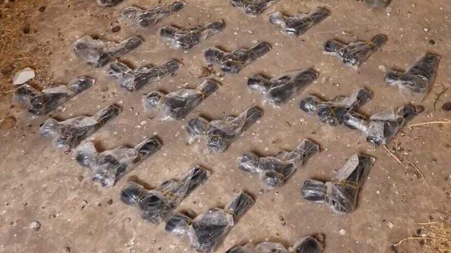 Handguns seized by Israeli security forces after they were smuggled across the border from Jordan. Credit: IDF.
