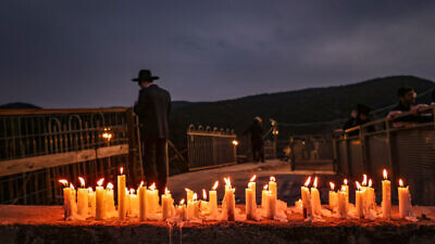 Candles mark the site of the Meron disaster, at the Rashbi's gravesite on Mount Meron in the Galilee, March 2, 2022. Photo by David Cohen/Flash90.