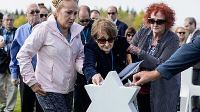 The dedication of a new headstone for a fallen Jewish soldier at a World War II military cemetery. Credit: courtesy of Operation Benjamin.