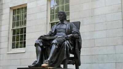 A statue of John Harvard at Harvard University in Cambridge, Mass. Credit: Pixabay.