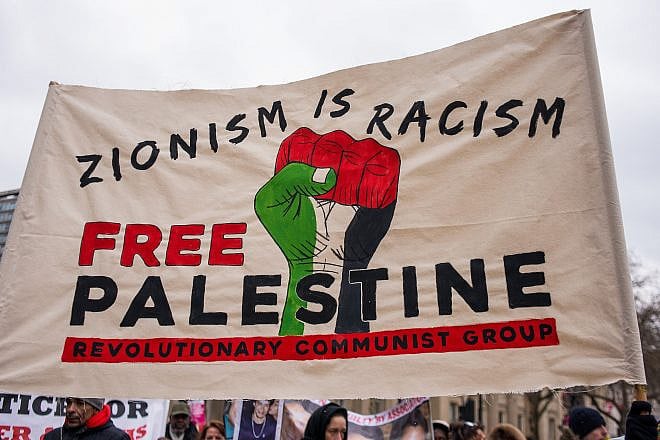 One of the larger banners and posters seen at the “March Against Racism” national demonstration in London, in protest of the dramatic rise in race-related attacks, March 17, 2018. Credit: John Gomez/Shutterstock.