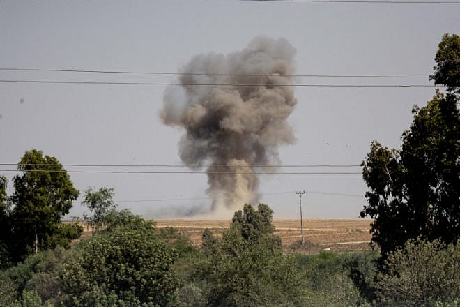 A cloud of smoke rises after a rocket launched from the Gaza Strip hit an open field near Sderot on Aug. 7, 2022. Photo by Yonatan Sindel/Flash90.