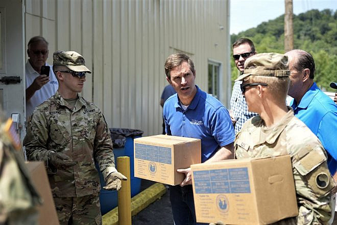 Kentucky Gov. Andy Beshear helps in the wake of devastating flooding in eastern Kentucky on Aug. 2, 2022. Source: Twitter/@GovAndyBeshear.