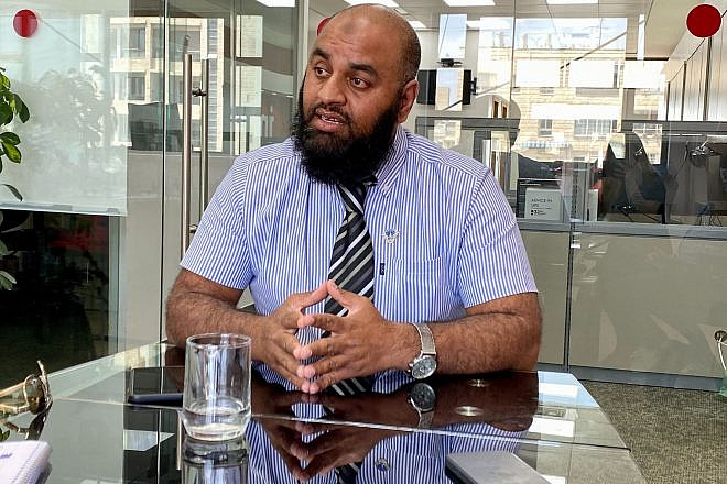 Noor Dahri, counterterrorism researcher and a former officer with the London Police, at the JNS office in Jerusalem, August 2022. Photo by Jennifer Schrutt.