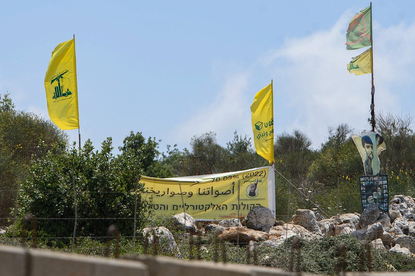 Hezbollah flags on the northern border between Israel and Lebanon, July 3, 2022. Photo by Ayal Margolin/Flash90.