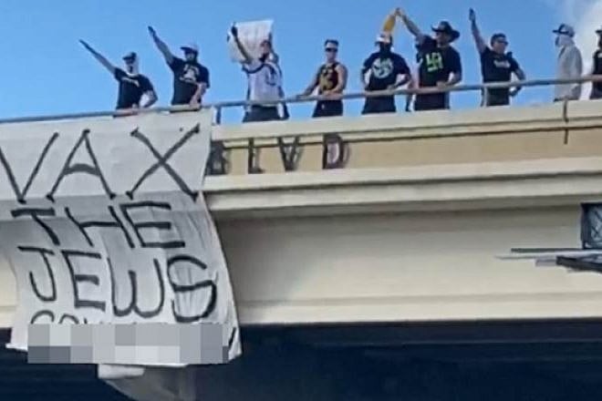 A banner hung by Goyim Defense League activists from an overpass in Austin, Texas, October 2021. Source: ADL.