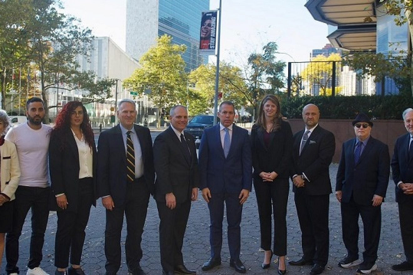 The StandWithUs press conference at the U.N. on Oct. 27. Speakers, pictured from left to right, included Sarri Singer, Anne Bayefsky, Asaf and Shani Avigal, Colonel Richard Kemp, William Daroff, Ambassador Gilad Erdan, Carly Gammill, Pastor Robert Stearns, Rabbi Eric J. Greenberg, Eric Fingerhut and Olga Meshoe-Washington. Credit: StandWithUs.