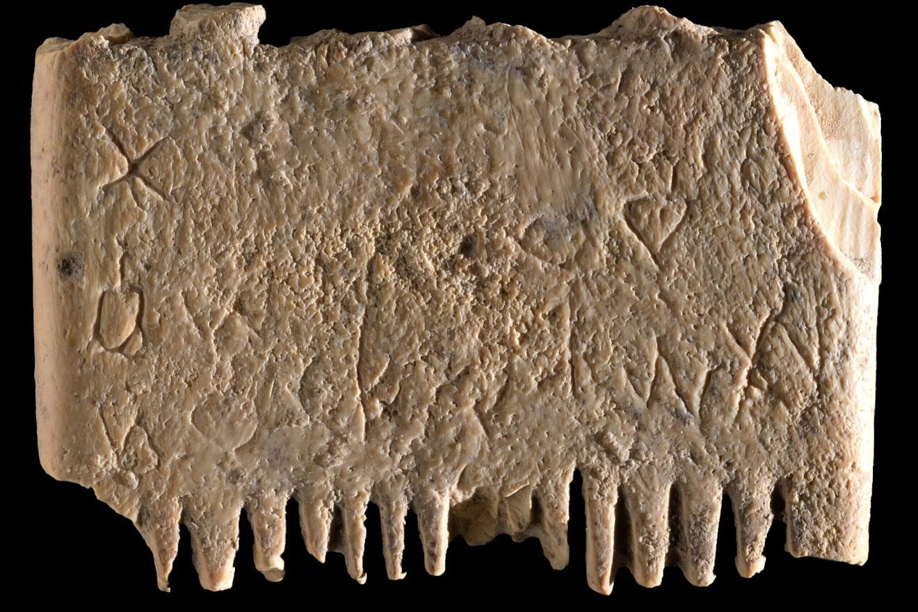 Engraved on this small ivory comb is a Canaanite spell against lice. The inscription reads: "May this tusk root out the lice of the hair and the beard." Photo by Dafna Gazit, Israel Antiquities Authority.