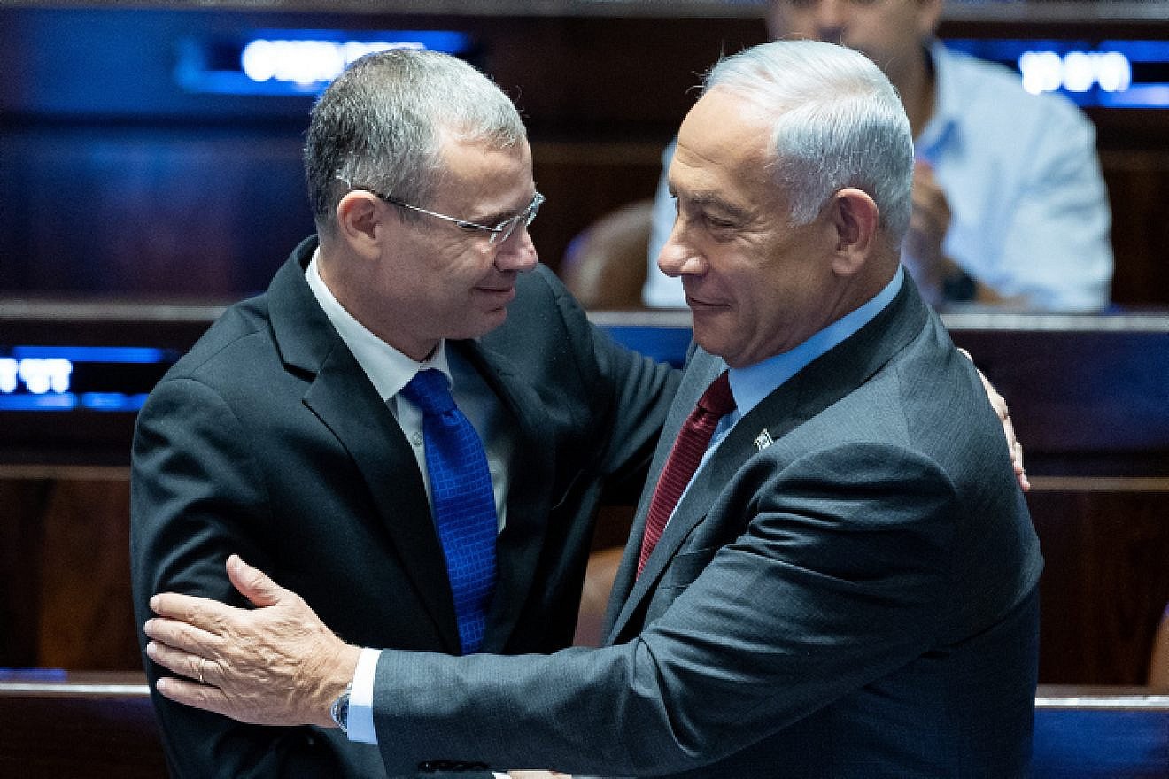 Knesset Speaker Yariv Levin, soon to be justice minister, and incoming Prime Minister Benjamin Netanyahu speak at the legislature in Jerusalem, Dec. 13, 2022. Photo by Yonatan Sindel/Flash90.