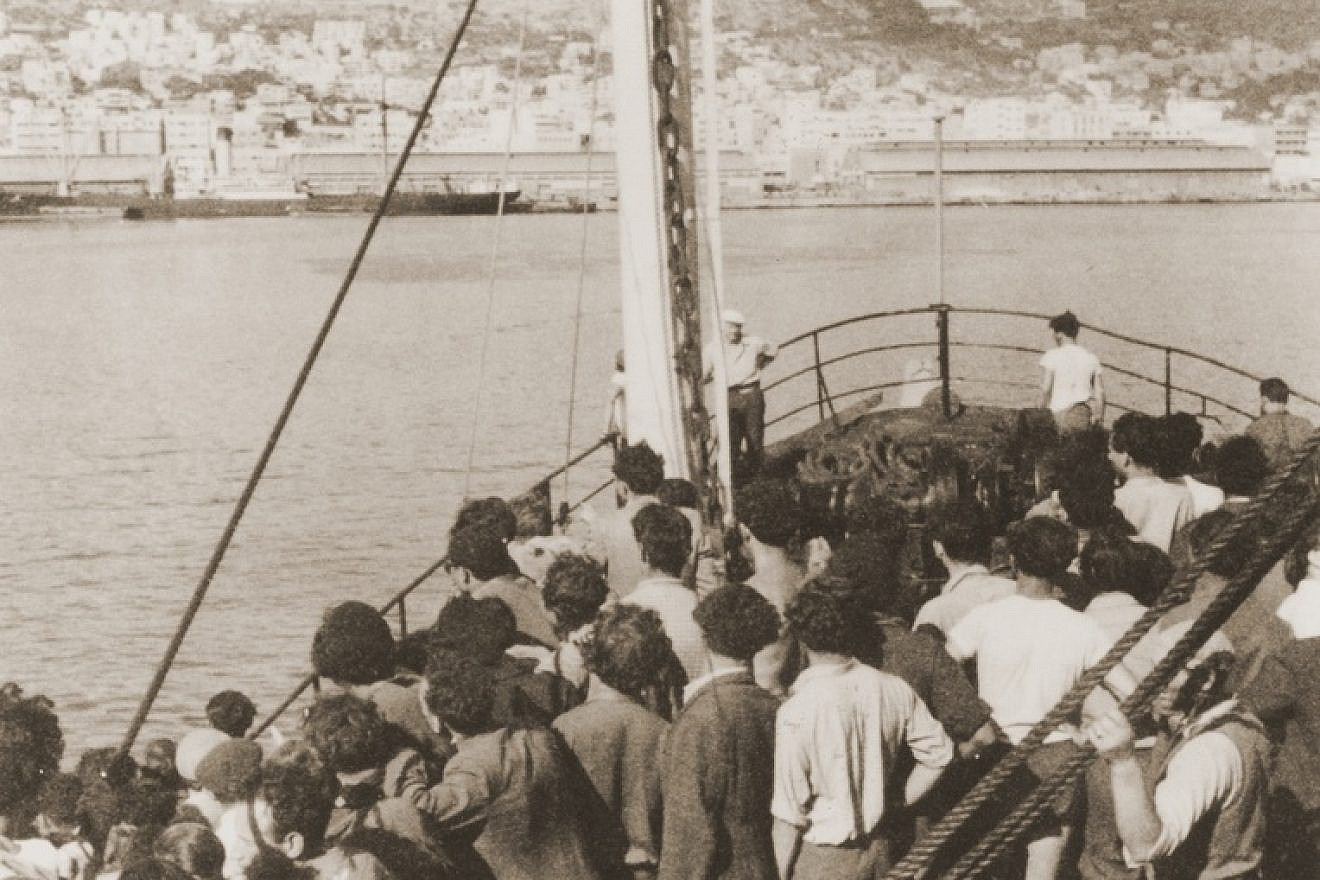 Passengers view Mount Carmel from the deck of the Mala immigrant ship as it enters the port of Haifa, July 11, 1948. Credit: United States Holocaust Memorial Museum, Courtesy of Martin Silver.