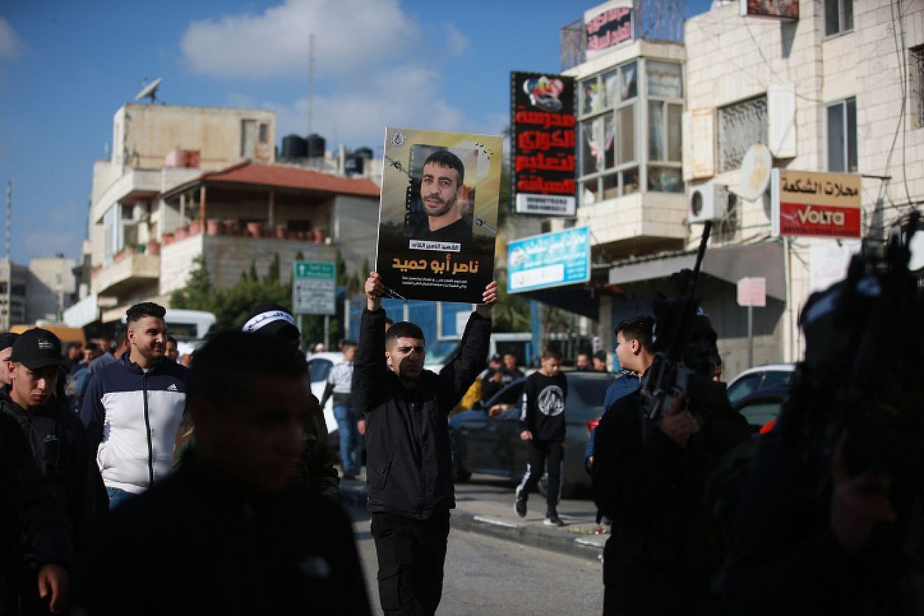 Palestinians take part in a protest in Ramallah following the death of security prisoner Nasser Abu Hamid, Dec. 20, 2022. Photo by stringer/FLASH90.