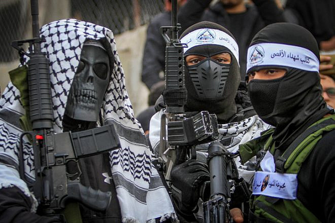 Members of the Fatah movement's Balata Brigade take part in a parade in the Balata refugee camp on the outskirts of Nablus, Dec. 24, 2022. Photo by Nasser Ishtayeh/Flash90.