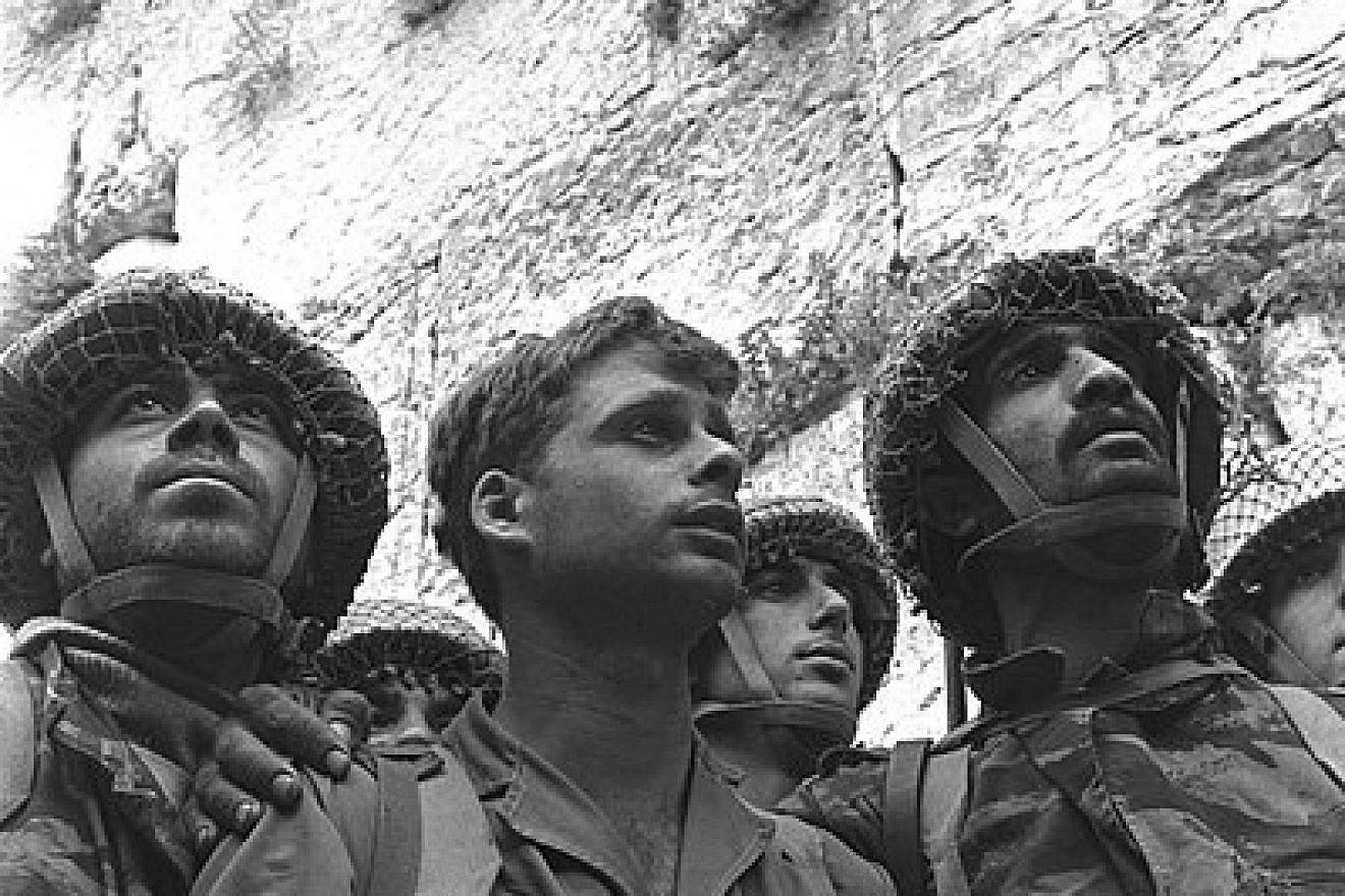 Israeli paratroopers stand in front of the Western Wall in Jerusalem after gaining back the Old City as part of the Six-Day War. Yitzhak Yifat is center, June 7, 1967. Credit: National Photo Collection of Israel, Goverment Press. Office.