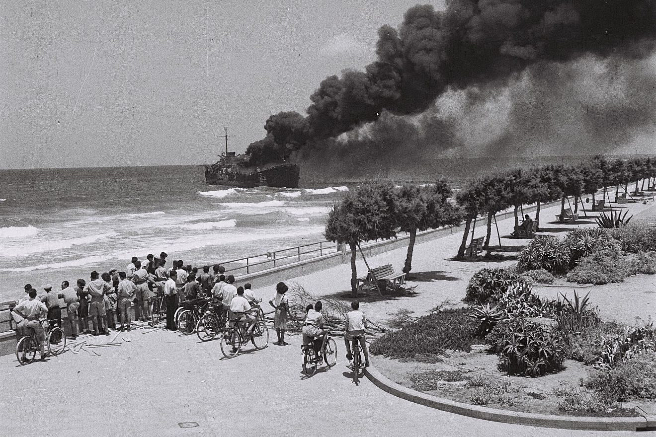The Irgun ship “Altalena” burning off the Tel Aviv beach after being shelled by the Haganah on June 22, 1948. Credit: Hans Pinn via Wikimedia.
